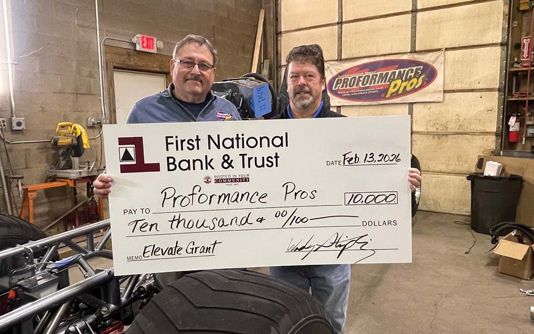 Randy Kleikamp, owner of Proformance Pros, is shown with Wes Stripling of First National Bank & Trust